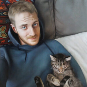 Young man with cat